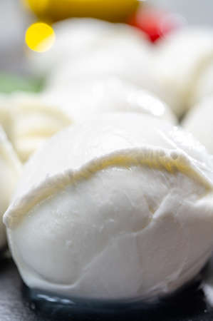 Tasty italian food, fresh white buffalo mozzarella soft cheese balls from Campania close upの写真素材