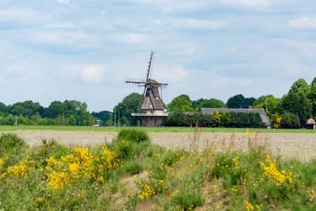 Countryside landscape with Dutch windmill, Oerle, Veldhoven, North Brabant, Netherlands in springの写真素材