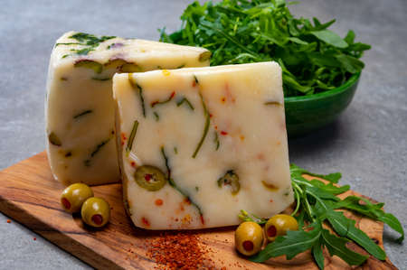 Cheese collection, fresh Italian pecorino cheese made from sheep milk filled with green olives...