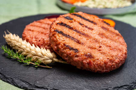 Source of fibre plant based vegan soya protein grilled burgers, meat free healthy food close upの写真素材