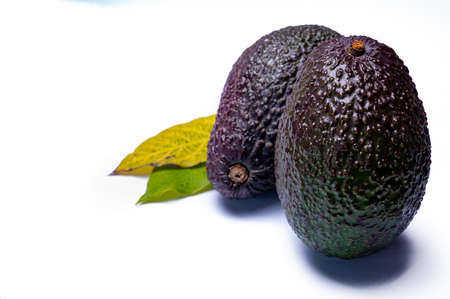 Healthy food, fresh ripe hass avocado fruit from Peru isolated on white backgroundの写真素材