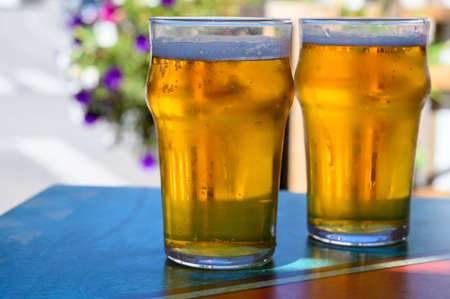 French cold beer in misted glasses served on outdoor terrace in small Alpine village in France close upの写真素材