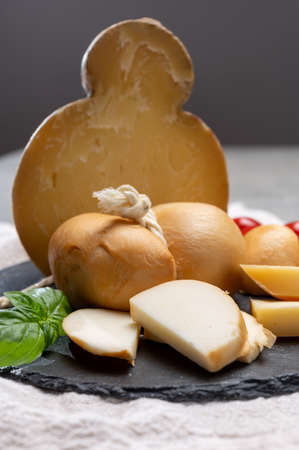 Italian semi hard handmade smoked scamorza and caciocavallo matured in caves cheeses made from cow...