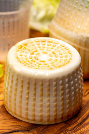 Cheese collection, italian soft smoked burrata cheese made from mozzarella with cream inside in region Apulia close upの写真素材