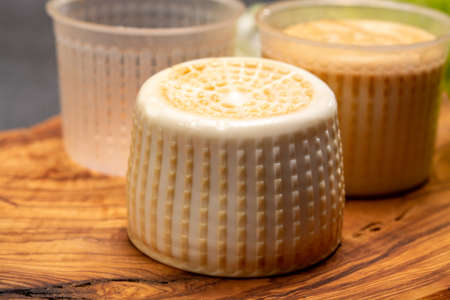 Cheese collection, italian soft smoked burrata cheese made from mozzarella with cream inside in...