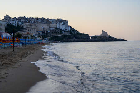 Sandy beach of medieval small touristic coastal town Sperlonga and sea shore, Latina, Italy on sunrise in summerの写真素材