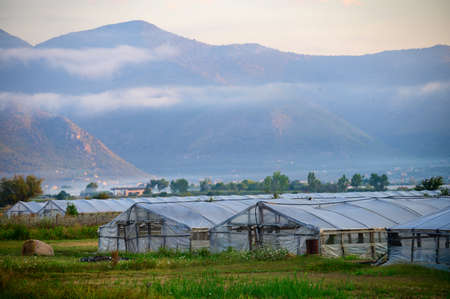 View on very fertile agricultural valley Plain of Fondi, Latina with fields and greenhouses on...