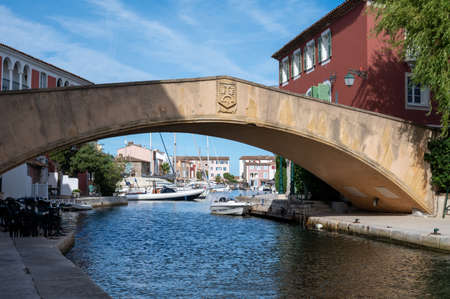 View on houses, roofs, canals and boats in Port Grimaud, Var, Provence, France in summerの写真素材