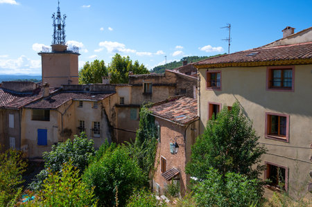 Travel destination, small ancient village Cotignac in Var, Provence, surrounded by vineyards and cliffs with troglodytes houses.の写真素材