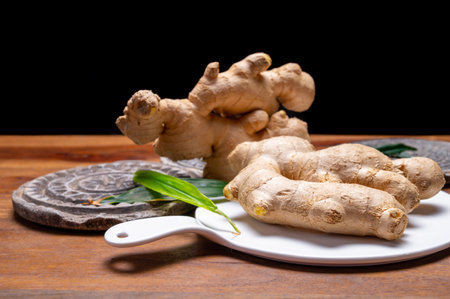 Fresh organic ginger rhizome root used in traditional medicines and for flavoring meals, drinks worldwide.の写真素材