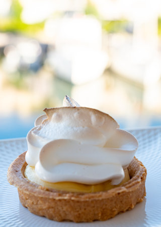 One piece of lemon tart with white eggs meringue from French pastry shopの写真素材