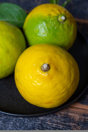 Fresh ripe bergamot orange fruits, fragrant citrus used in earl gray tea, medicine and spa treatments, close upの写真素材