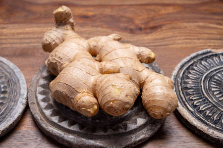 Fresh organic ginger rhizome root used in traditional medicines and for flavoring meals, drinks worldwide.の写真素材