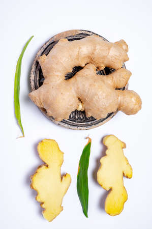Fresh organic ginger rhizome root used in traditional medicines and for flavoring meals, drinks,...
