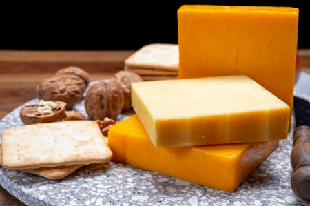 Cheese collection, orange and yellow smoked British cheese from England close up
