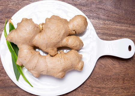 Fresh organic ginger rhizome root used in traditional medicines and for flavoring meals, drinks worldwide.の写真素材