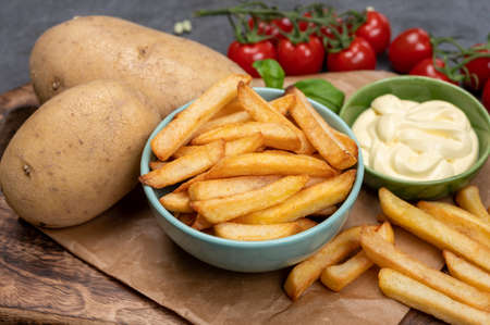 Bown with fresh cooked french fries potato chips with belgian mayonnaise sauce close upの写真素材