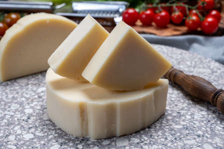 Cheese collection, Italian pasta filata aged cheese provolone from Cremona, Northwest of Italy, close upの写真素材