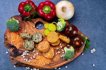 Small colorful tasty vegan and vegetarian burgers made from fresh vegetables and dried legumes and beansの写真素材