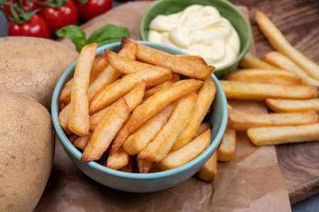 Bown with fresh cooked french fries potato chips with belgian mayonnaise sauce close upの写真素材