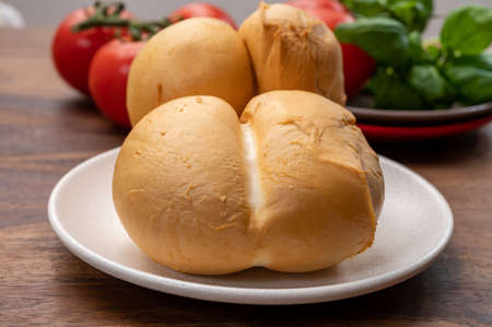 Cheese collection, Italian yellow smoked caciocavallo or scamorza cheese from Pugliaの写真素材