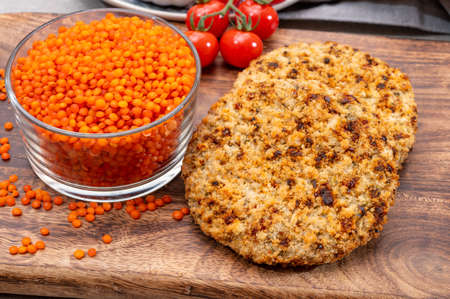 Healthy vegetarian or vegan food, meat free burger made from orange lentils legumes close upの写真素材