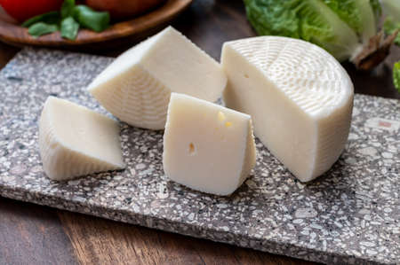Cheese collection, white Italian sheep cheese pecorino primo sale from Sicily island close upの写真素材