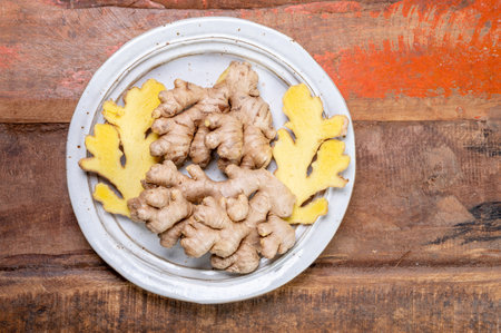 Fresh organic ginger roots, healthy food ingredient close up