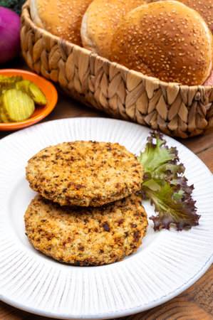 Making of vegetarian burgers with round patties or burgers made from grains, vegetables and legumesの写真素材