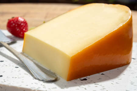 Cheese collection, piece of young Dutch gouda cheese made from cow milk in Netherlands close up