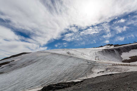 View on icy glacier near winter and summer sky station Les deux Alpes in summerの写真素材