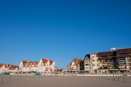 Yellow sandy beach in small Belgian town De Haan or Le Coq sur mer, luxury vacation destination, summer holidays on sunny dayのeditorial素材