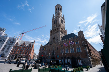 27 April 2021, Bruges, Belgium, walking on medieval Bruges streets in historical city center in sunny day, travel destinationのeditorial素材