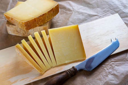 Cheese collection, French comte and Swiss gruyere cheeses close upの写真素材