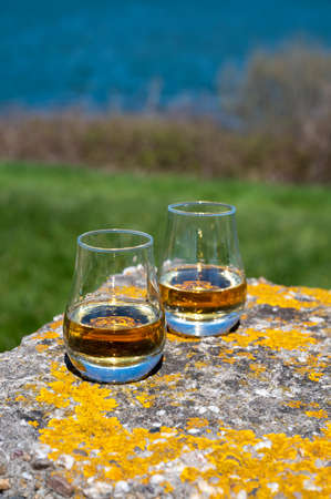 Tasting of single malt and blended Scotch whiskey with blue sea, ocean or river view, private whiskey tours in Scotland, UKの写真素材