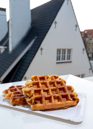 Belgian sugar waffles served outdoor in beautiful Belgian village De Haanの写真素材