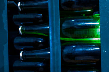 Champagne grand cru sparkling wine production in bottles in rows in dark underground cellars, Reims, Champagne, Franceの写真素材