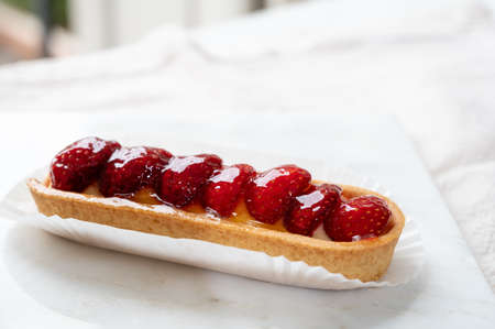 French cuisine, fresh baked strawberry cake served in old French cafe