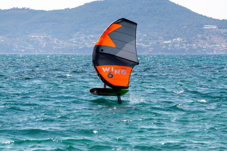 2021. Extreme water sports - wing foil, kite surfing, wind surfindg, windy day on Almanarre beach...