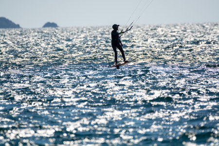 2021. Extreme water sports - wing foil, kite surfing, wind surfindg, windy day on Almanarre beach near Toulon, South of Franceのeditorial素材