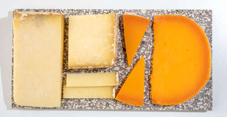 Cheese collection, hard French cheese old cantal fermier and yellow mimolette made from raw cow milk...