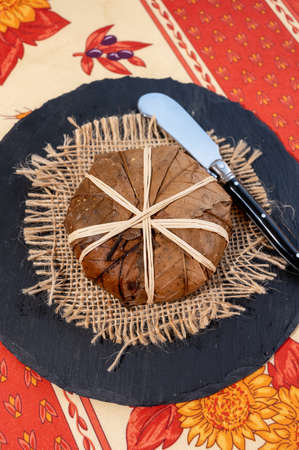 Taste of Provence, ancient small goat cheese Banon a la feuille wrapped in chestnut leaves and tied...