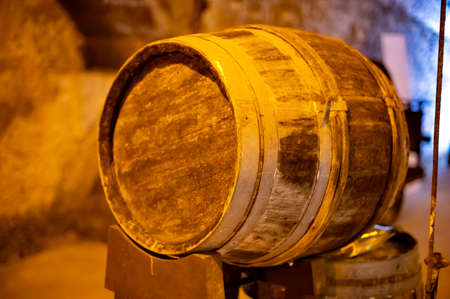 Walking in deep and long undergrounds caves with dusty barrels, making champagne sparkling wine from chardonnay and pinor noir grapes in Reims, Champagne, France.の写真素材