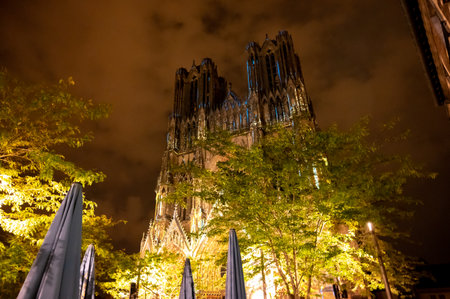 View on gothic Roman Catholic cathedral church Notre-Dame in central part of old French city Reims, France at nightの写真素材