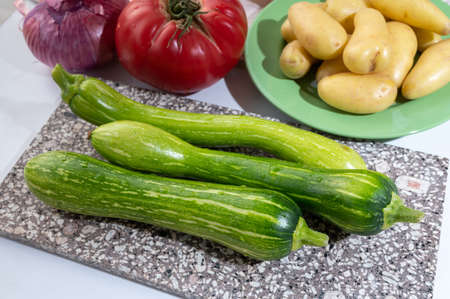 Fresh green long squash zucchini gevetables from Nice ready to cook, Provence, Franceの写真素材