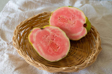 Fresh ripe aromatic pink guava tropical fruit ready to eatの写真素材