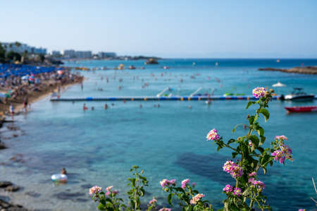 Crystal clear blue water of Mediterranean sea on white sandy Fig tree beach in Protaras, Cyprusの写真素材