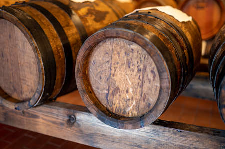 Traditional production and aging in wooden barrels of black Italian Balsamic wine IGP and DOC vinegar dressing in Modena, Italyの写真素材