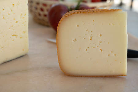 Cheese collection, French fol epi cheese with many little holes, etorki, tomme noire des pyrenees...