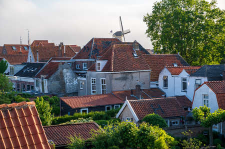 Walking in old Dutch town Zierikzee, red roofs of old small houses, Zeeland, Netherlandsの写真素材